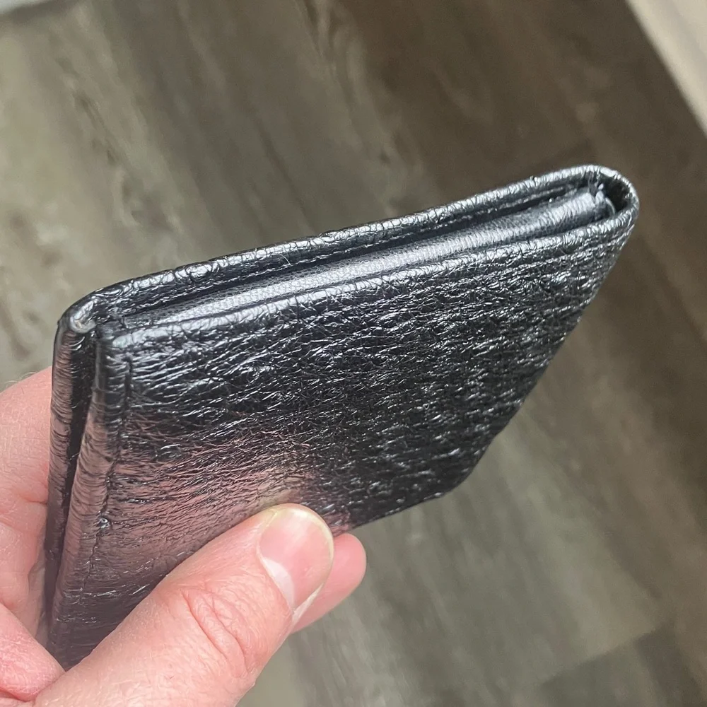 black bifold wallet made from genuine ostrich leather.
